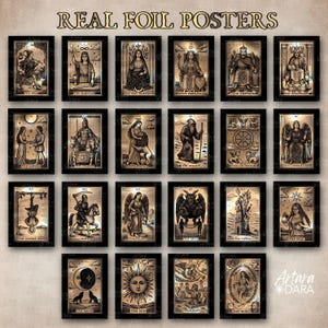 May include: A collection of framed tarot card posters with gold foil accents. Each black framed poster features a different card from the tarot deck, including The Fool, The Lovers, and The Sun. The words "REAL FOIL POSTERS" are at the top.