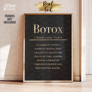 May include: A black framed print with gold text that reads "BOTOX | 'bǝutoks | noun - English AN ELIXIR OF YOUTH, A COSMETIC MARVEL THAT GRACEFULLY ERASES THE TRACES OF TIME, LEAVING BEHIND A VISAGE OF TIMELESS ELEGANCE AND REJUVENATED ALLURE."