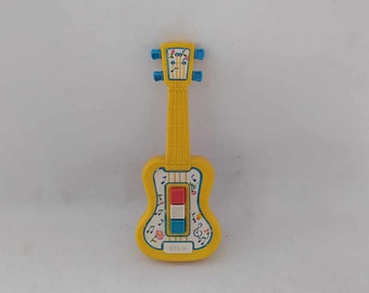 Vintage Chicco Band Button Mini Musical Guitar Toy Hecho en Italia 1980 usado en buenas condiciones
