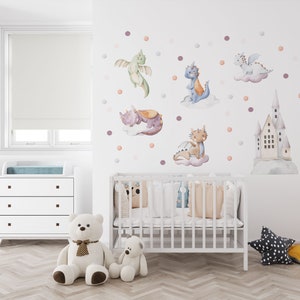 Sweet baby dragon nursery wall art set displaying multiple baby dragons, clouds and fairytale castles – high-quality dragon sticker and watercolor nursery decal design.
