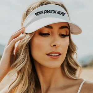 May include: White visor with the text "YOUR DESIGN HERE" printed in black.