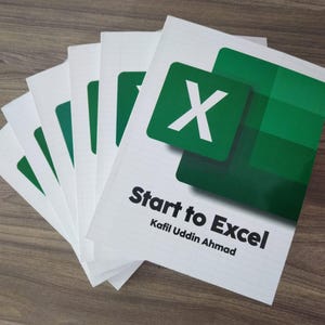 May include: A collection of white books featuring the Microsoft Excel logo in green. The title "Start to Excel" is printed in black, along with the author's name, Kafii Uddin Ahmad. The books are stacked on a wooden surface.