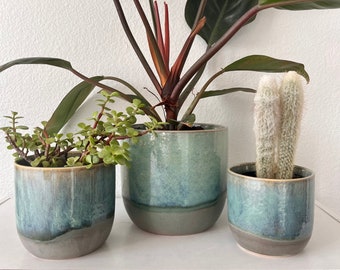 Reactive glaze, turquoise, and gray planter comes in three different sizes