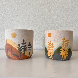 Mojave pot hand painted planter with sand finish. Comes in 2 different styles forest and desert. 4” x 4”