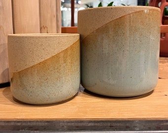 Reactive glaze, blue, and sand  colored ombré planter. Available in 2 sizes. 3 3/4”x 3 3/4” and 4 3/4” x 4 3/4”