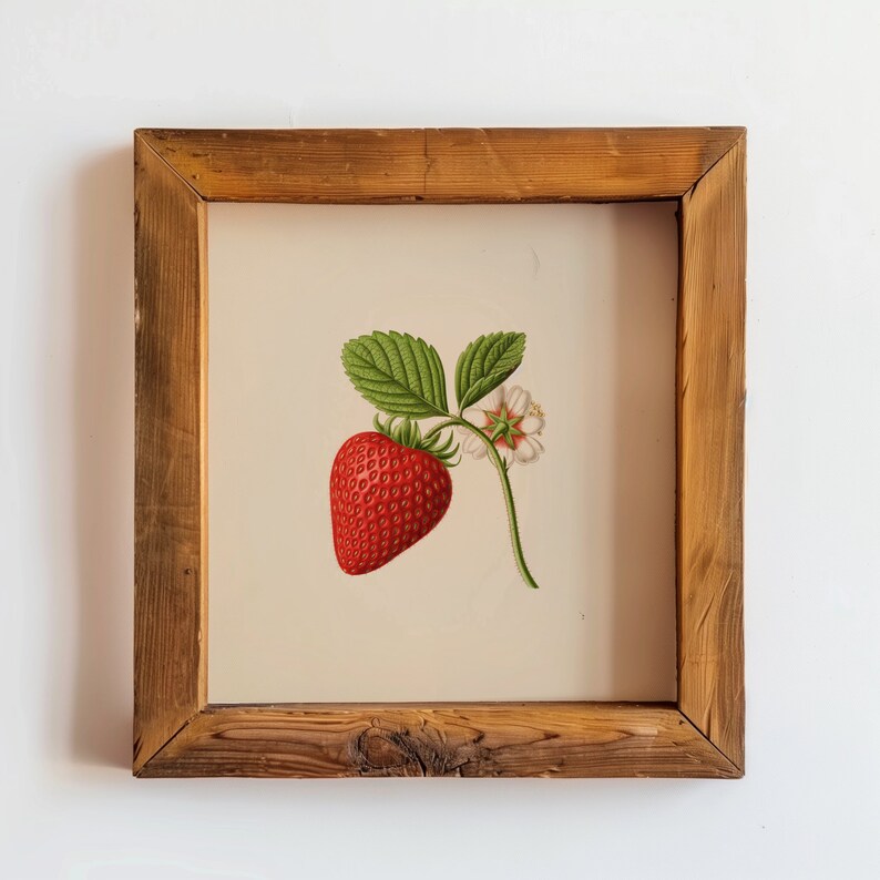 May include: A framed botanical illustration of a single red strawberry with green leaves and a white flower. The frame is made of natural wood with a rustic finish.