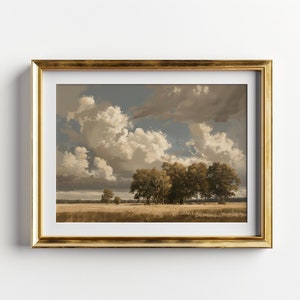 May include: A framed landscape painting depicting a field with a group of trees in the foreground and a cloudy sky above. The painting is in a gold frame.