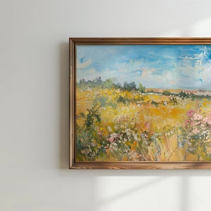 May include: A framed oil painting depicting a landscape scene with a field of wildflowers in the foreground, a forest in the background, and a blue sky with white clouds.