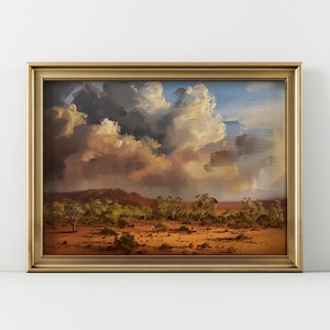 May include: A framed painting depicting a landscape with a dramatic sky. The sky is filled with large, fluffy clouds, some of which are dark and stormy. The landscape below is a dry, brown desert with scattered trees.