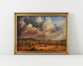 May include: A framed painting depicting a landscape with a dramatic sky. The sky is filled with large, fluffy clouds, some of which are dark and stormy. The landscape below is a dry, brown desert with scattered trees.