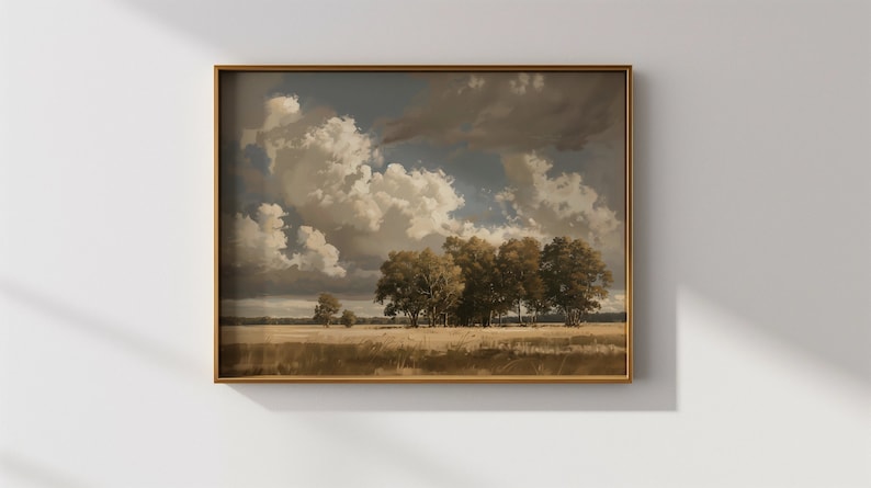 May include: A framed painting of a landscape with a group of trees in a field under a cloudy sky. The sky is a light blue with large white clouds. The trees are a dark green and the field is a light brown.