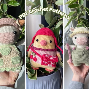 May include: Three crocheted amigurumi toys: a cow, a chick, and a pig. Each toy is wearing a different outfit and holding a farm-themed accessory. The toys are all made with soft yarn and have adorable faces.
