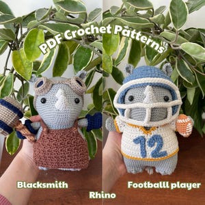 May include: Two crocheted rhino amigurumi toys. One is a grey rhino wearing goggles and holding a hammer, labeled "Blacksmith". The other is a grey rhino wearing a blue football helmet and jersey with the number "12", labeled "Football player".