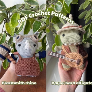 May include: Two crocheted amigurumi figures: a blacksmith rhino and a bayou bard alligator. The rhino is gray, brown, and blue, holding a hammer. The alligator is green and brown, playing a stringed instrument. Text reads "PDF Crochet Patterns".