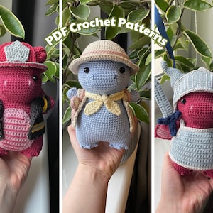 May include: Three crocheted dragon plushies in different outfits. The first dragon is wearing a red firefighter hat and jacket. The second dragon is wearing a blue hat and a yellow scarf. The third dragon is wearing a blue helmet and armour.  PDF Crochet Patterns.