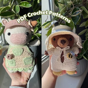 May include: Two crocheted amigurumi toys, a cow holding an ice cream cone and a bear wearing a hat. The cow is wearing a green and white dress and the bear is wearing a white dress with a bee on it.  PDF Crochet Patterns.
