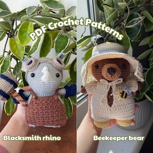 May include: Two crochet amigurumi dolls: a blacksmith rhino and a beekeeper bear. The rhino is gray with brown overalls and holds a hammer. The bear is brown, wearing a white outfit and a hat with a bee. Text reads "PDF Crochet Patterns".