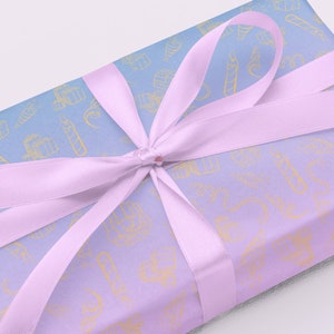 Light Blue to Light Pink Birthday Wrapping Paper with Pictures of Ribbon, Gifts and Other Party Favors | Baby Shower Gift Wrap