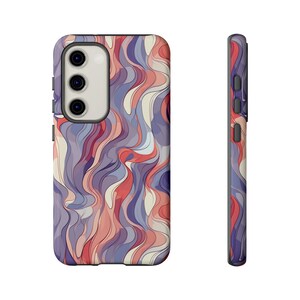 Puede incluir: Una funda para teléfono con un diseño abstracto colorido con remolinos de rojo, azul y blanco.