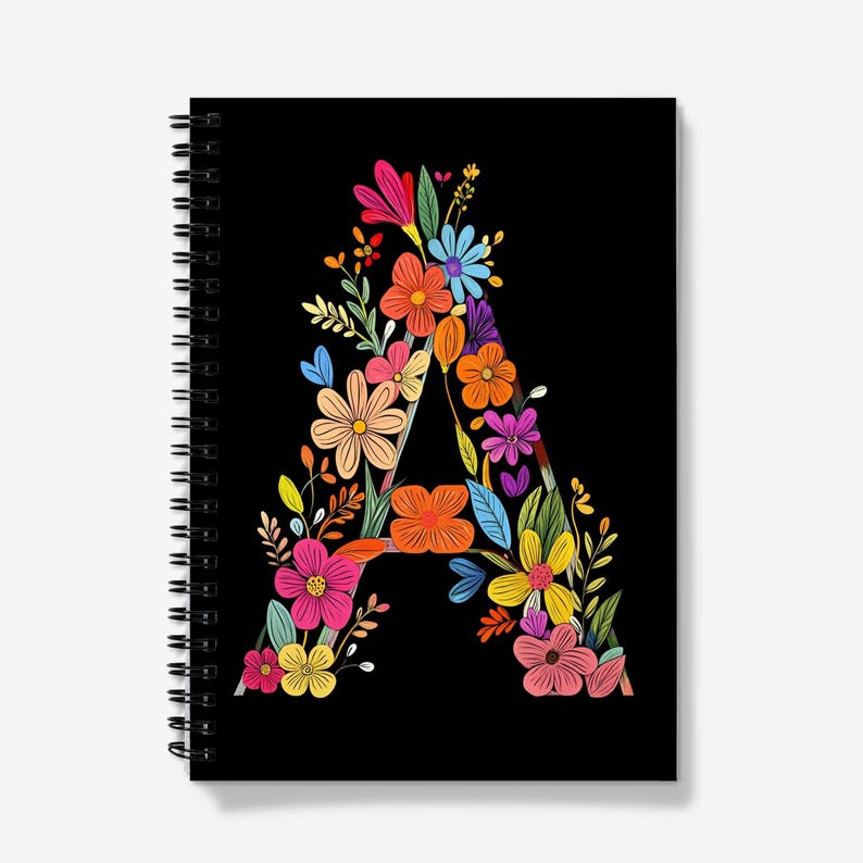 May include: A black spiral notebook with a colorful floral design forming the letter "A".