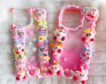 May include: A pink and white phone case decorated with a variety of colorful 3D characters, including a pink and white cow, a pink and yellow character with a crown, and a pink and white character with a hat. The case also features pink and white hearts, stars, and the word "love".