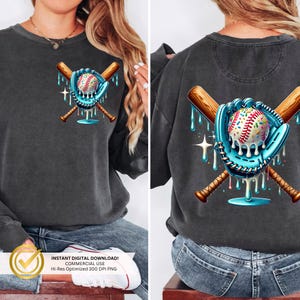 May include: A dark gray sweatshirt with a graphic of a baseball, baseball glove, and two crossed bats dripping with blue and white icing. The graphic is centered on the front of the sweatshirt.