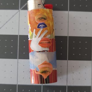 May include: A red, yellow, and blue lighter with a collage of eyes, lips, and a hand covering a mouth.