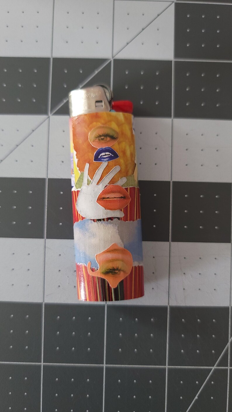 May include: A red, yellow, and blue lighter with a collage of eyes, lips, and a hand covering a mouth.