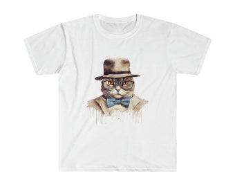 May include: A white t-shirt featuring a watercolour illustration of a cat wearing a brown hat, round glasses, and a blue bow tie.