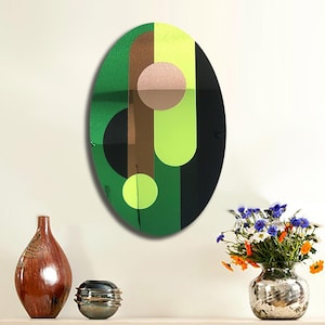 May include: A green, brown, black, and yellow abstract geometric design on a round canvas. The design features overlapping circles and stripes.