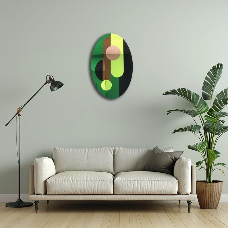 May include: A green, black, yellow, and brown abstract oval wall art piece with geometric shapes.