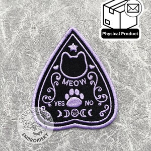 May include: Purple and black embroidered iron-on patch featuring a cat silhouette, a paw print, and the words "MEOW", "YES", and "NO".