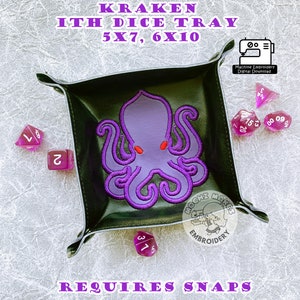 May include: Purple embroidered kraken design on a black leather dice tray. The tray is 12.7cm x 17.8cm and 15.2cm x 25.4cm. The text "Kraken Ith Dice Tray 5x7, 6x10" is at the top of the image. The text "Requires Snaps" is at the bottom of the image.