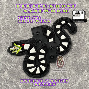 May include: Two black and white striped shoe charms featuring a green and red beetle ghost sandworm. The charms are designed for machine embroidery and are available in eyelet and satin styles. The text "BEETLE GHOST SANDWORM ITH 4X4 SHOE WING" is displayed above the charms.