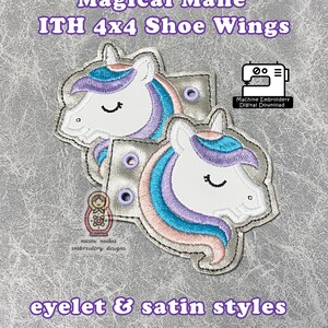 May include: A pair of unicorn shoe wings in a satin and eyelet style. The wings are white with pink, blue, and purple accents. The wings are designed for a 4x4 inch embroidery hoop. The image includes the text "Magical Mane ITH 4x4 Shoe Wings" and "eyelet & satin styles".