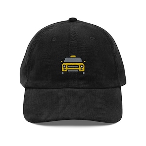 May include: Black corduroy baseball cap with an embroidered yellow taxi cab design.