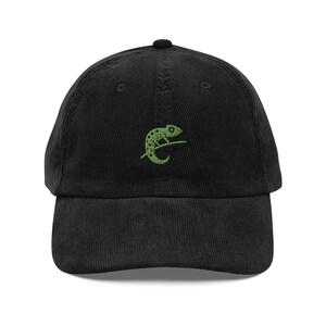 May include: Black corduroy baseball cap with a green embroidered chameleon design.