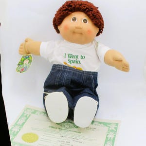 Cabbage Patch Kids 1985 Boy Doll &quot;I Went To Spain&quot; Outfit & Adoption Certificate