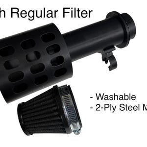 May include: Black air filter assembly with the text "With Regular Filter". The assembly includes a cylindrical body with a perforated section and a separate black filter with a metal clamp. Features include washable and 2-Ply Steel Mesh.