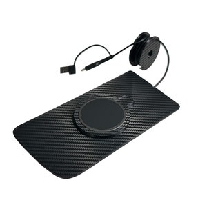 May include: A black wireless charging pad with a carbon fiber pattern. The pad has a circular charging area and a USB cable. A black cable spool is attached to the pad.