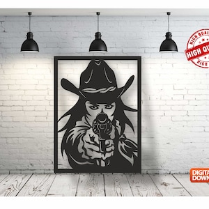 May include: Black and white silhouette of a woman wearing a cowboy hat and holding a gun. The image is framed in a black rectangle and set against a white brick wall.
