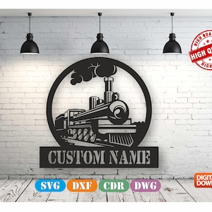 May include: Black metal train silhouette with the text "CUSTOM NAME" below the train. The train is inside a circular frame. The image includes the words "HIGH QUALITY" in a red circle and digital download icons.