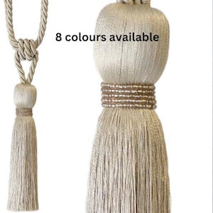 May include: A beige tassel tieback with a beaded trim. 8 colors available.