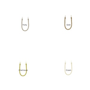 May include: Four different colors of rope curtain tiebacks. The colors are putty, gold, chartreuse, and cream.