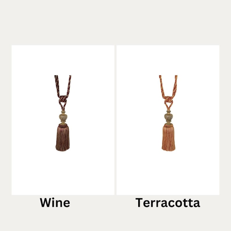 May include: Two curtain tiebacks with tassels, one in wine and one in terracotta.
