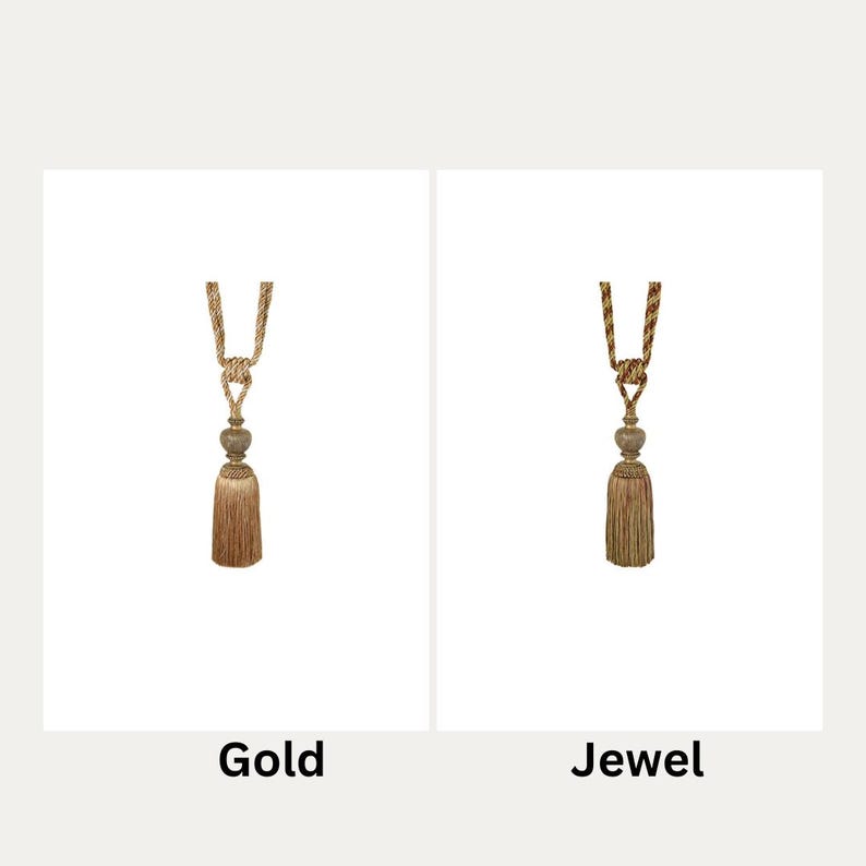 May include: Two curtain tiebacks with tassels. The tieback on the left is gold and the tieback on the right is jewel toned.