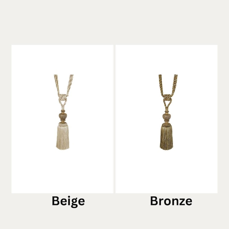 May include: Two curtain tiebacks with tassels. The tieback on the left is beige and the tieback on the right is bronze.