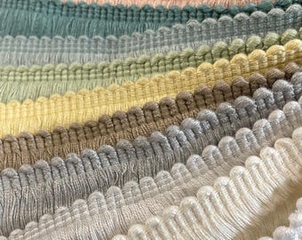 May include: A variety of colors of fringe trim, including navy, burgundy, peach, sage green, light green, yellow, beige, gray, white, and ivory.