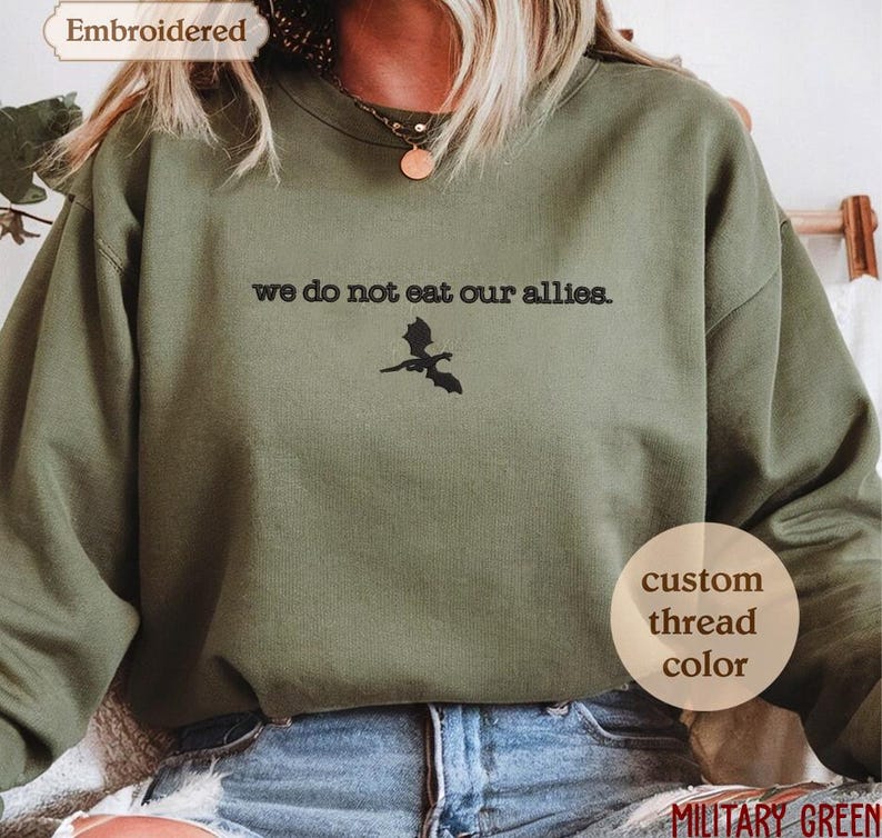 a woman wearing a sweatshirt that says we do not eat our allies