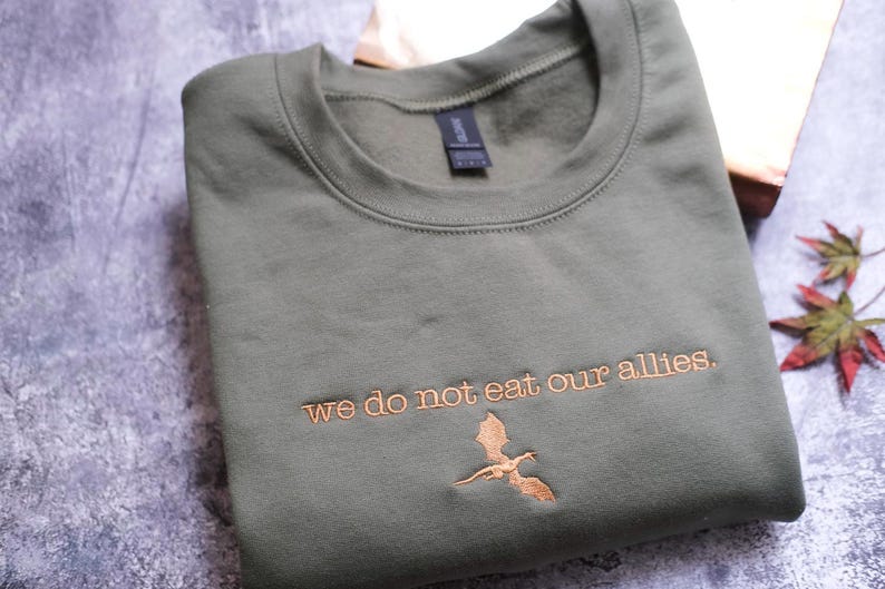 a t - shirt that says we do not eat our aliens